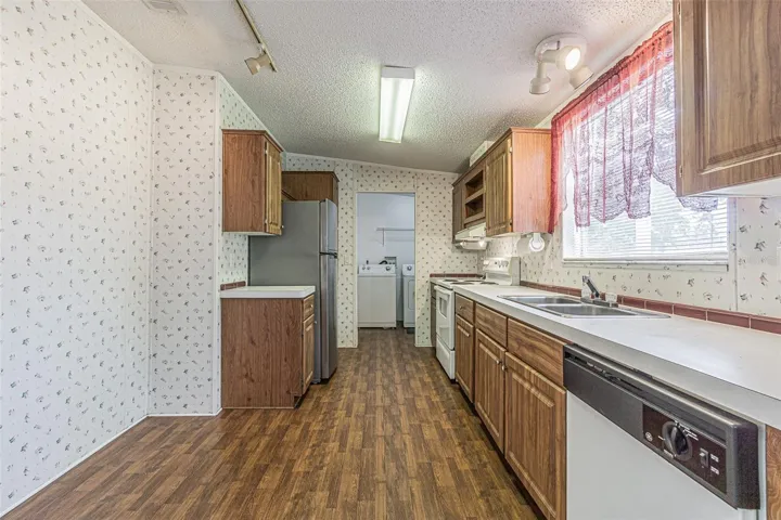 galley kitchen with loads of cabinets