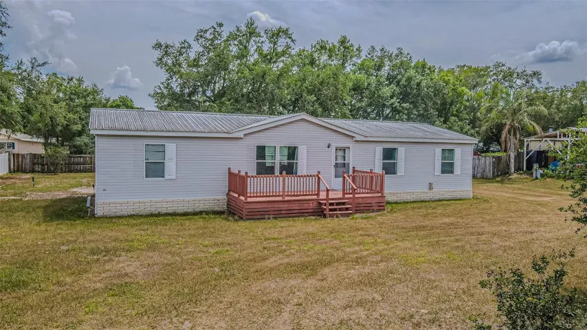 Metal roof and large yard on this Palm harbor home