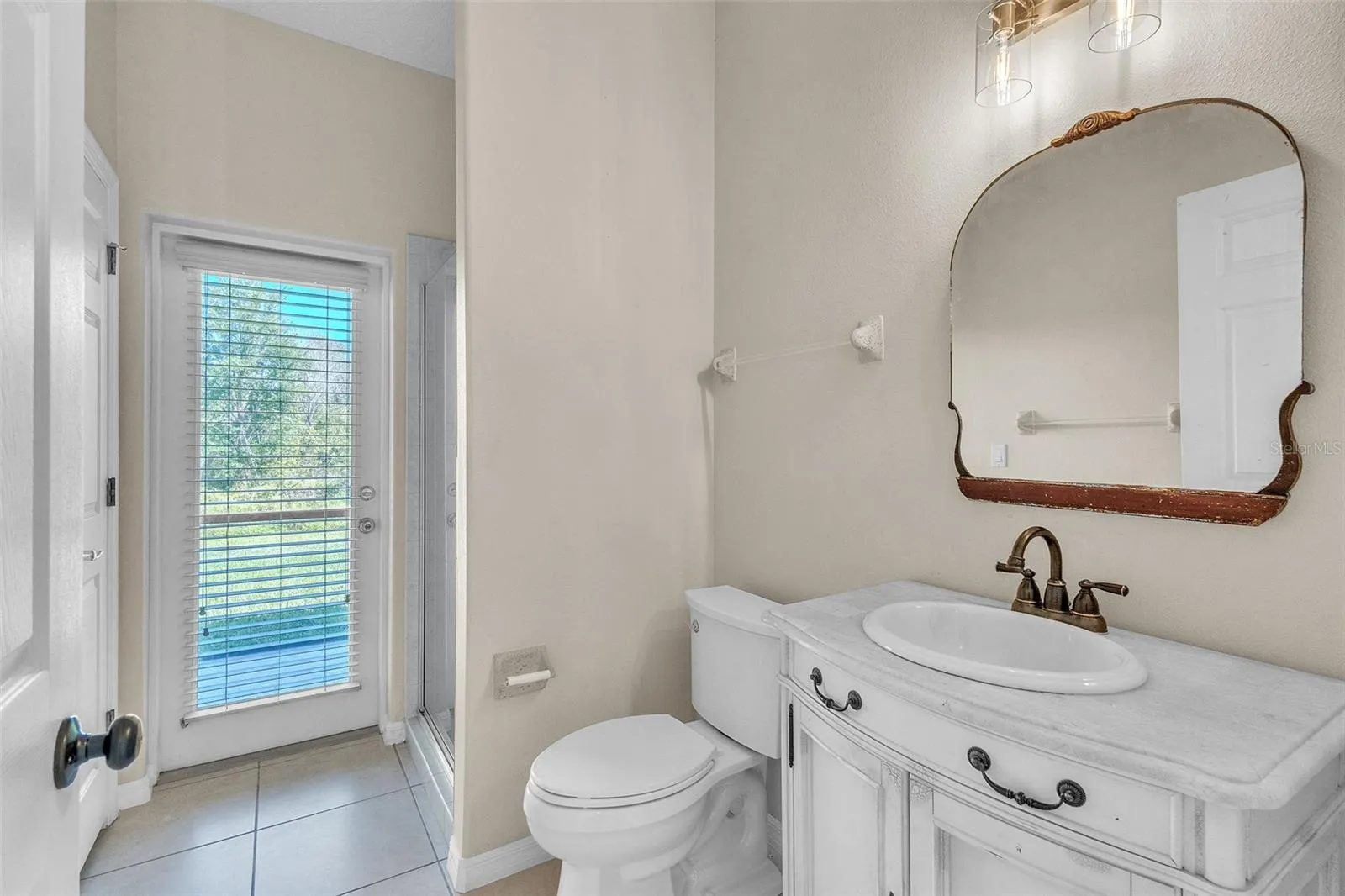 full bathroom - with access to the back patio