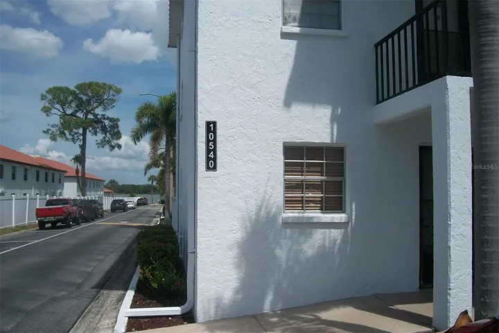 Front of the building, Second floor window is this corner unit