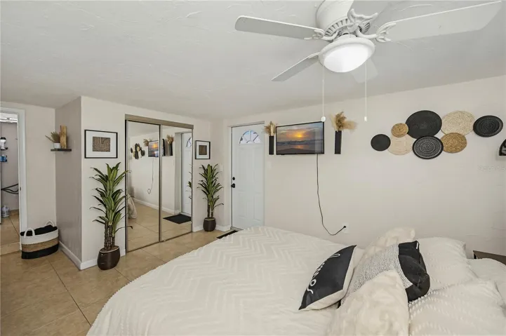 Master bedroom with door to the pool