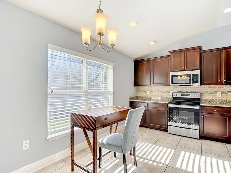 Breakfast nook overlooking kitchen and near pantry