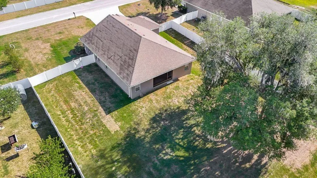 Aerial perspective showcasing the property's expansive nearly half-acre lot