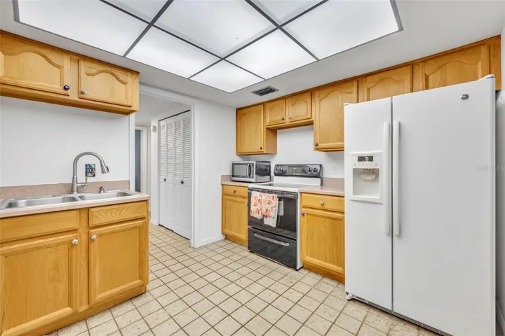 Kitchen with wood cabinets