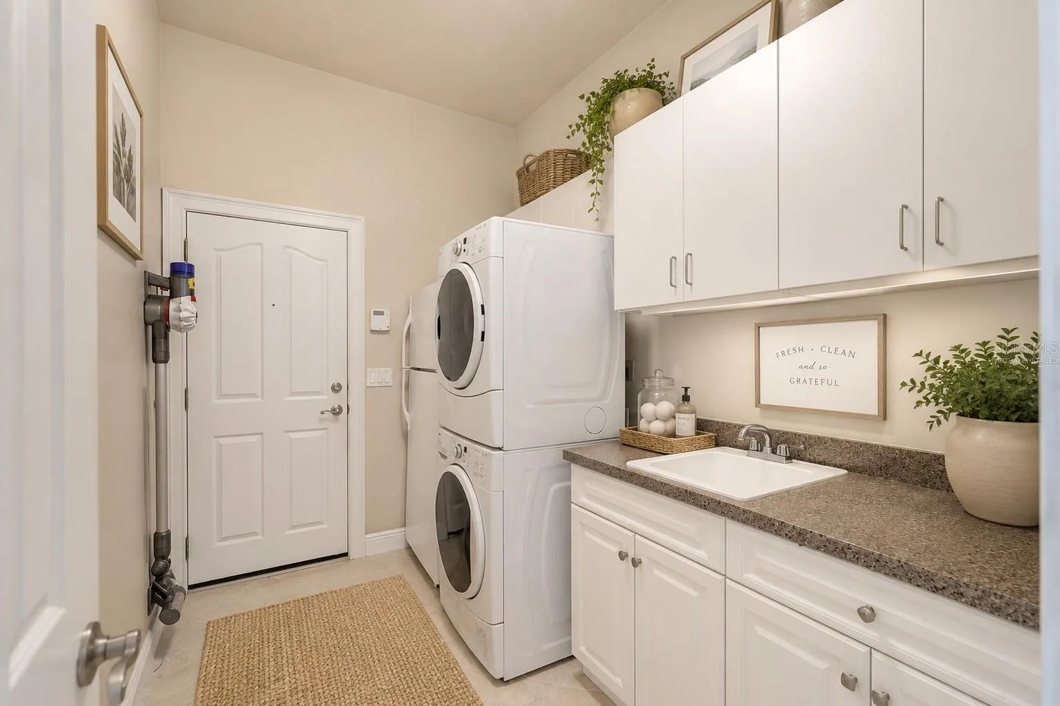 Beautiful laundry center, virtually staged