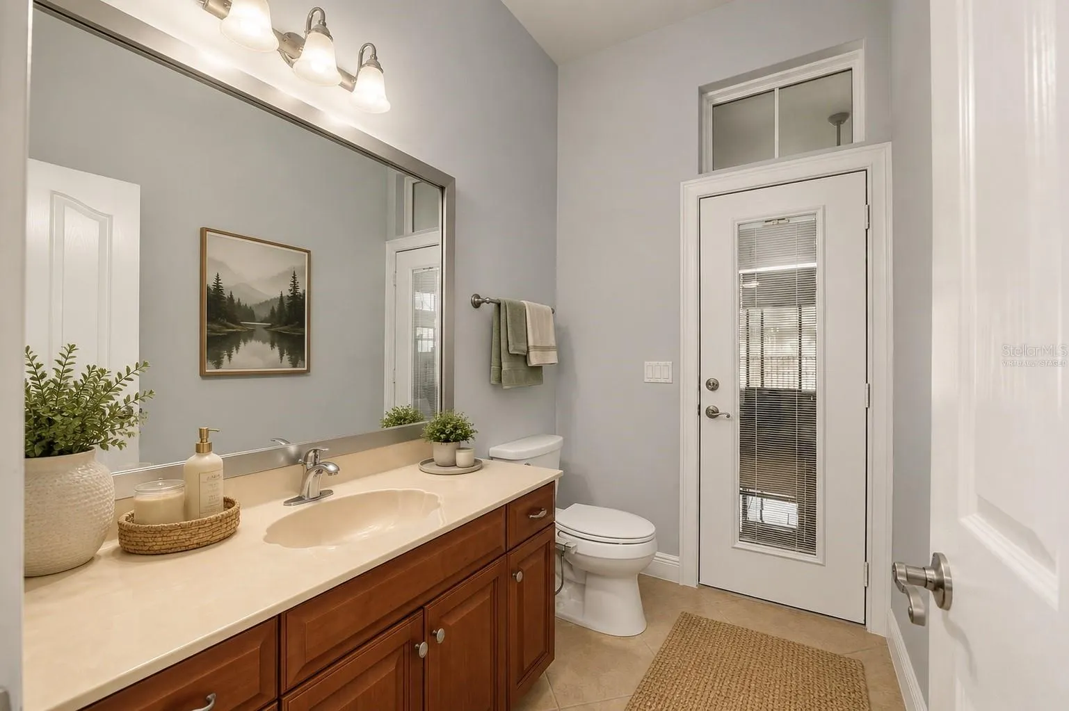 Sunroom has access to virtually staged bathroom
