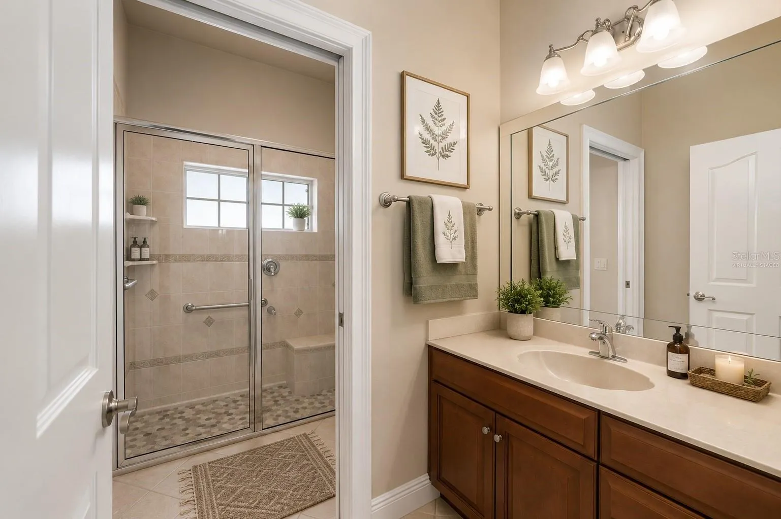 Secondary full bath, virtually staged