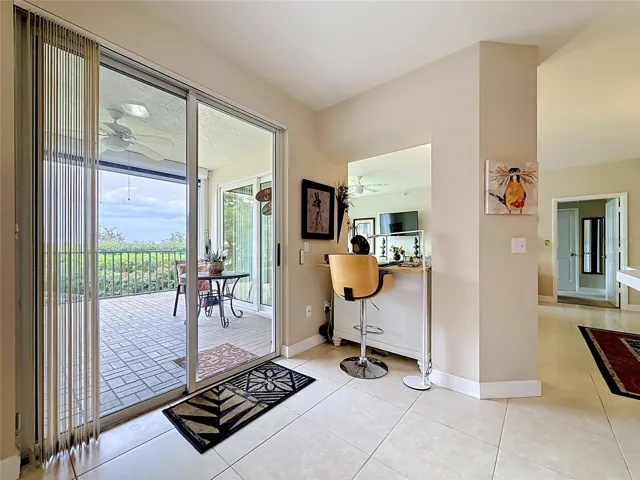 Sliding door off of kitchen, covered porch with an electric hurricane rated screen.