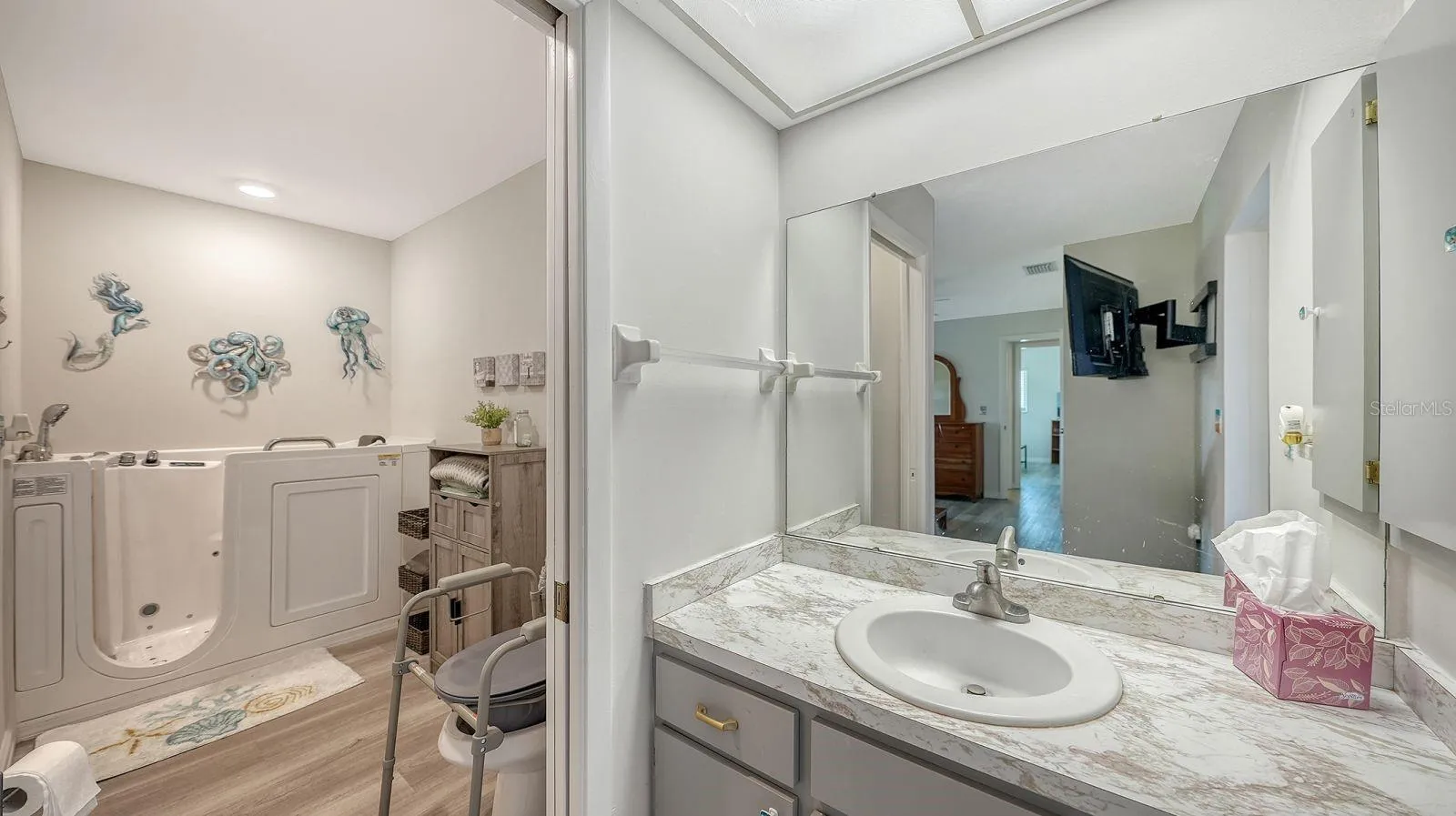 Primary Bathroom with a Walk-In-Tub & Shower