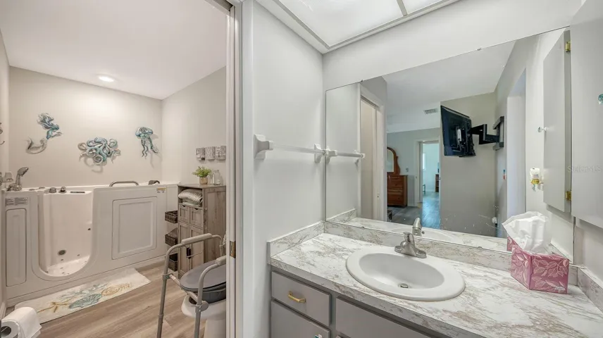 Primary Bathroom with a Walk-In-Tub & Shower
