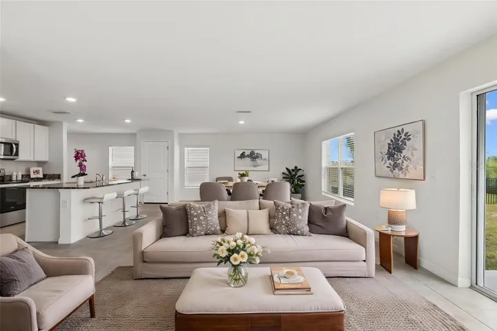 Virtually staged- great room with dining room
