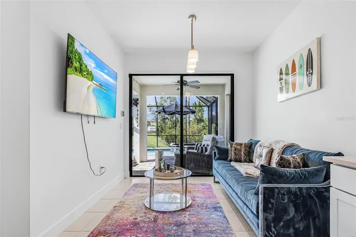 The owner has transformed the dining area into a stylish sitting space that easily opens to the outdoor living area with pool and spa. Perfect for entertaining