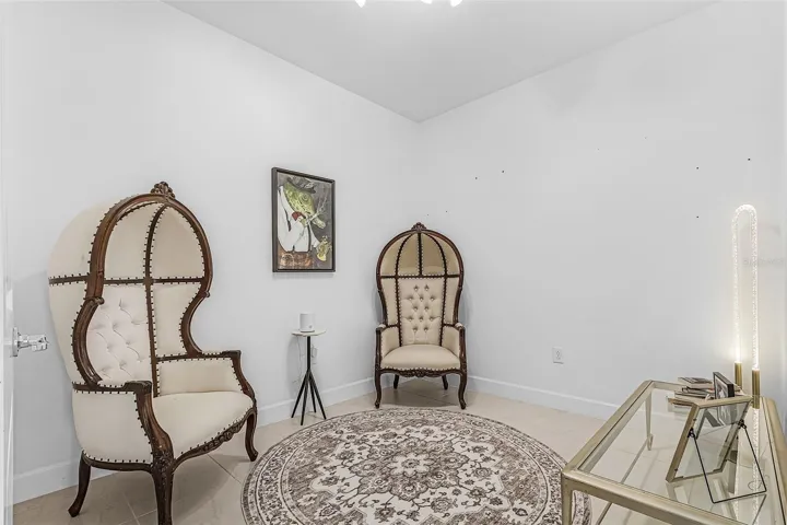 As you walk into the living area to your left you have a dedicated office,  currently as a sitting room, a quiet space to enjoy a good book.