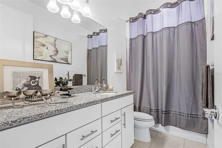 Large secondary bathroom with lots of cabinet space