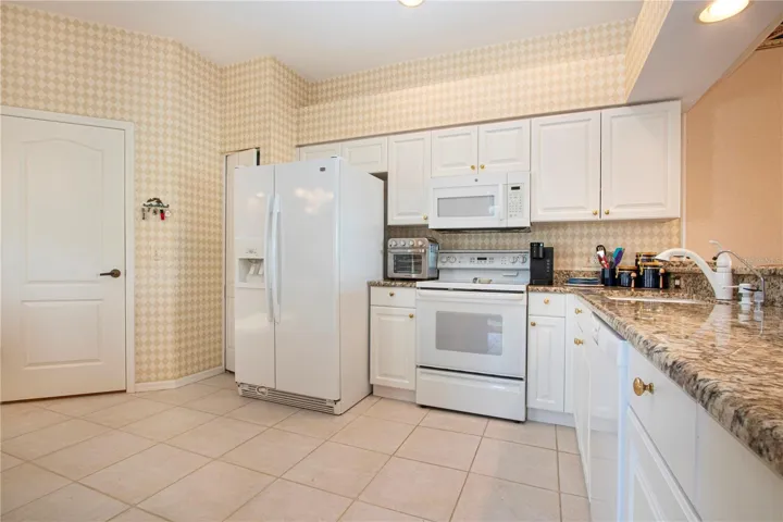 Kitchen to laundry room and garage.