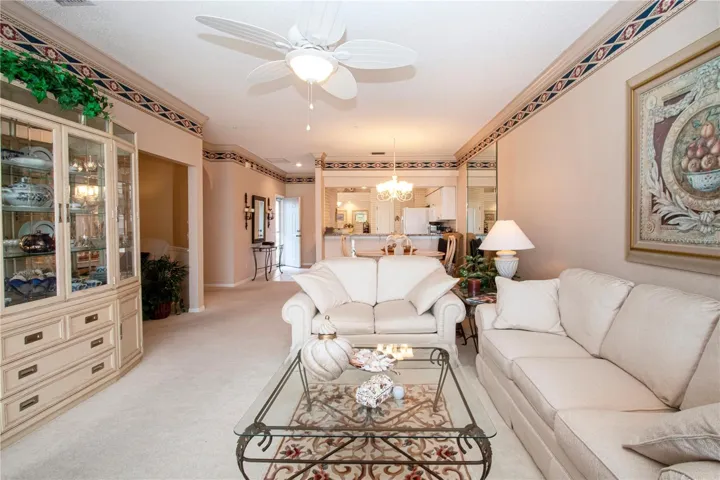 Living space to the front door and kitchen.