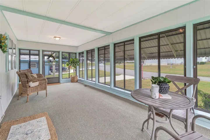 Florida Sunroom entering from Living Room. This room is amongst the Central HVAC Unit with two floor vents