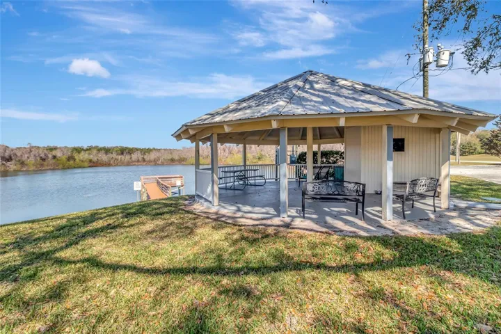 Community sitting area by the water and walking dock