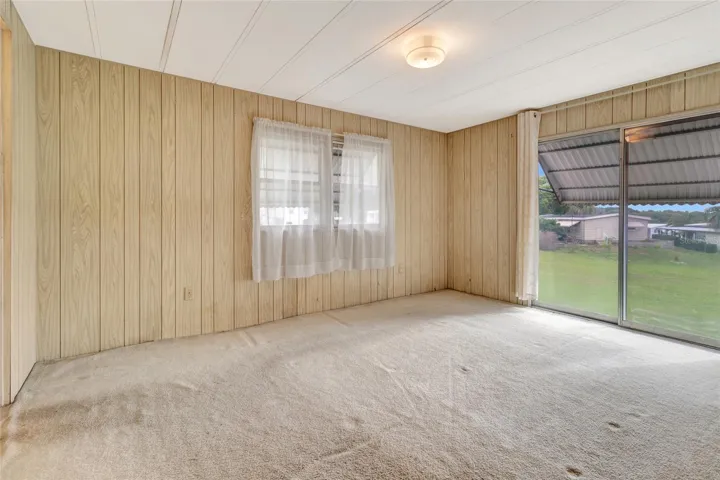 Primary Bedroom (Carpet and Paneling has been considered in Pricing)