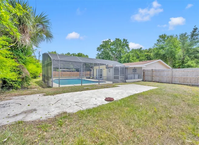 Private side yard with concrete pad