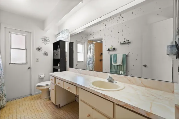 Primary bath with pool door access