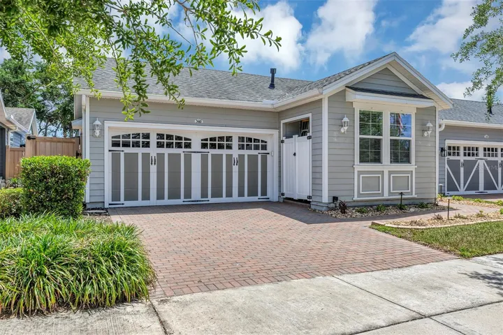 Front of home and driveway -doors on right of garage is the Utility meters