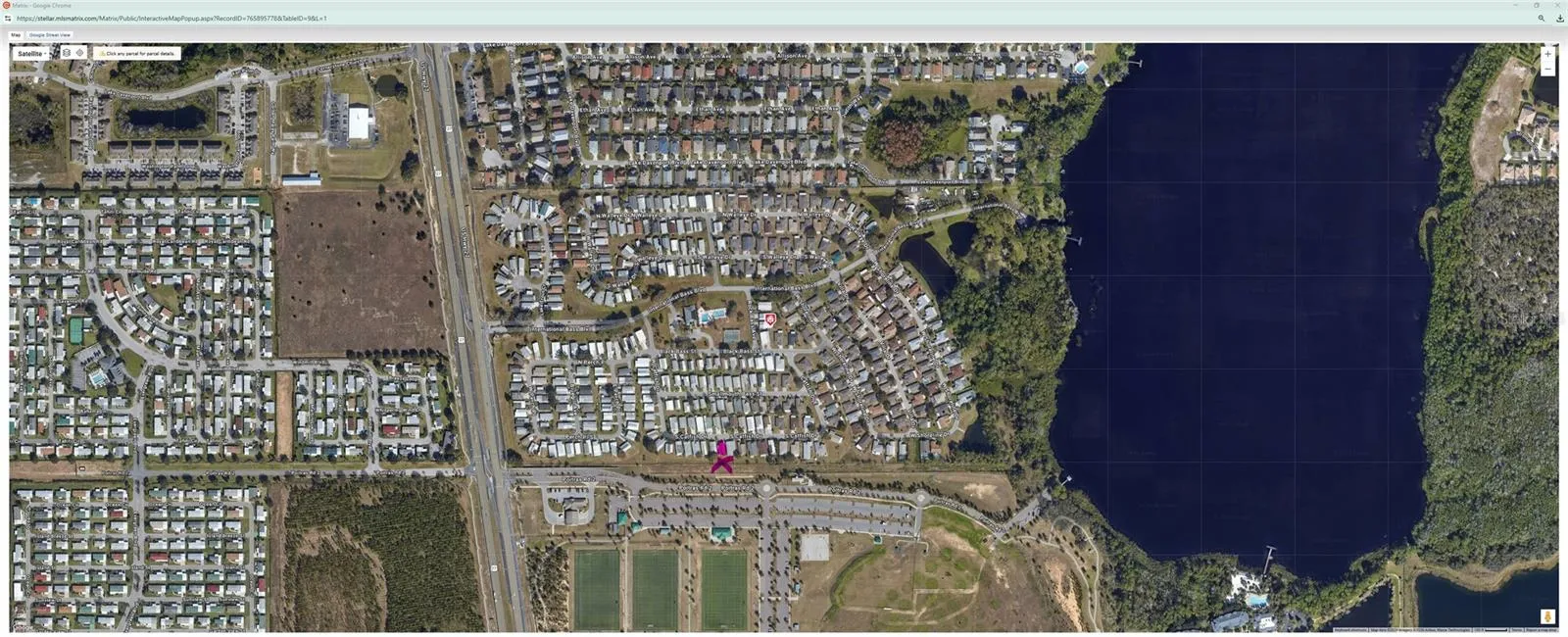 Aerial view of subdivision and lake