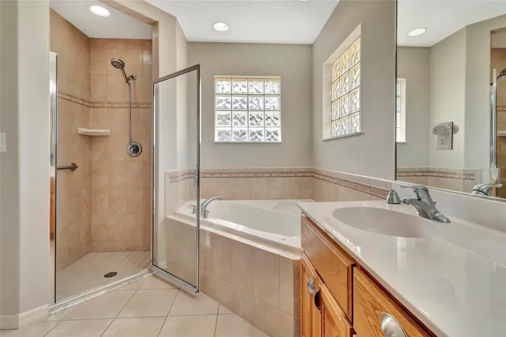 Separate step in shower from Jacuzzi Tub inside Primary 1 Bathroom