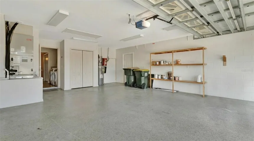 View from inside Garage showing updated Water Heater and Central Vacuum Unit