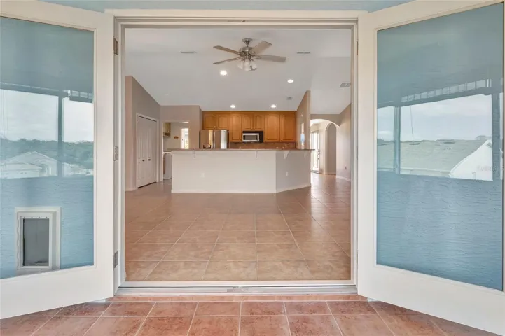 View from inside Rear Florida Room looking back into Living Room / Kitchen