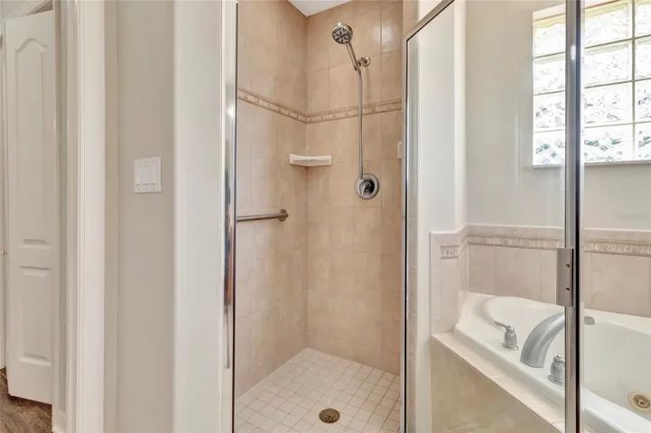 Another view of step in shower in Primary 1 Bathroom