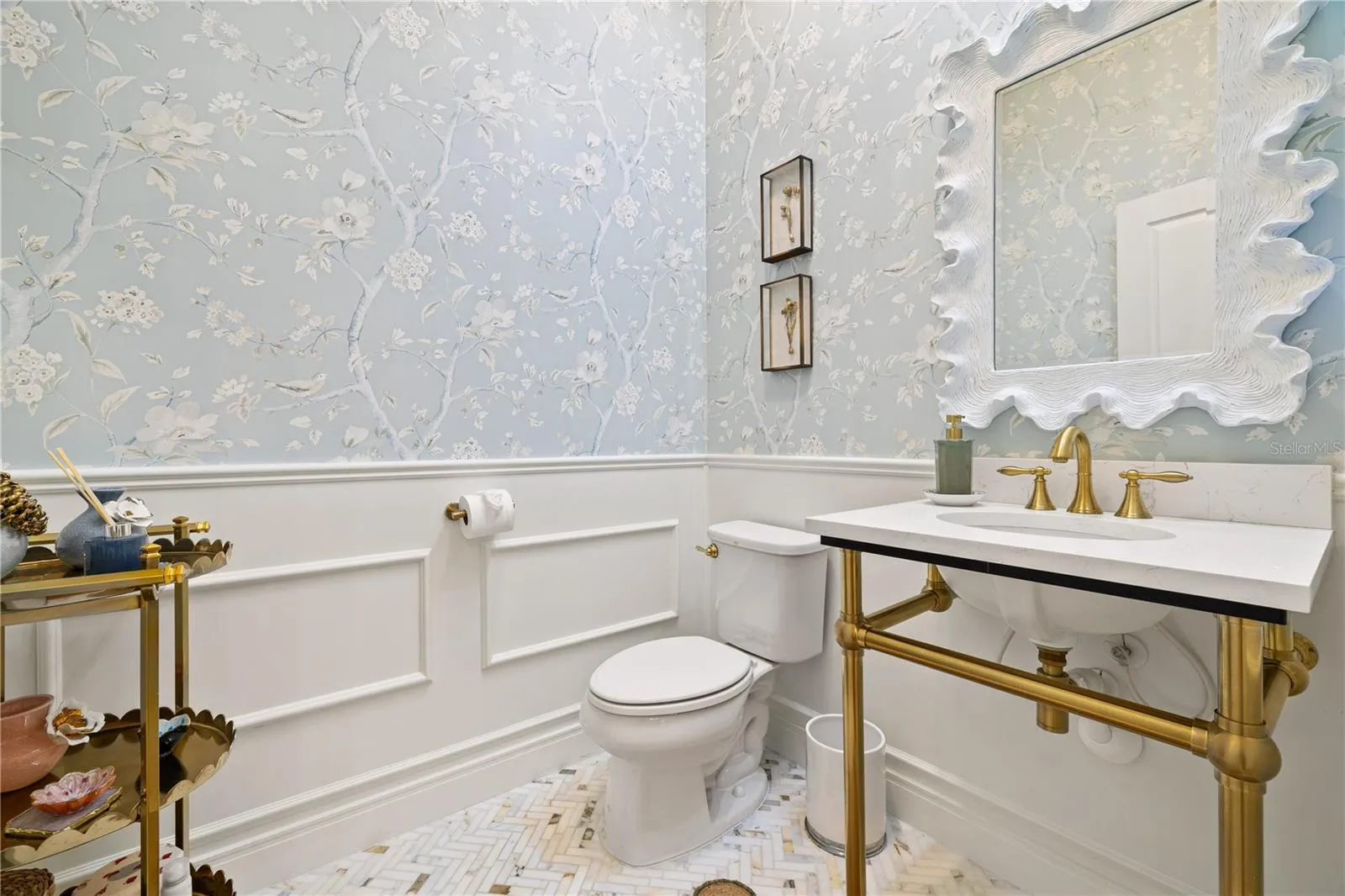 1/2 bathroom with boiserie and wall paper.