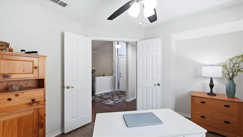 DEN OR POSSIBLE THIRD BEDROOM WITH THE ADDITION OF CLOSET DOORS