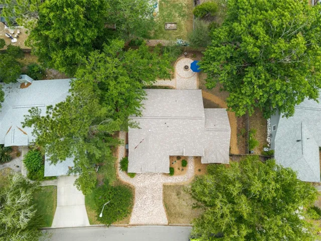 Pavers wrap around from front driveway through side yard to back patio