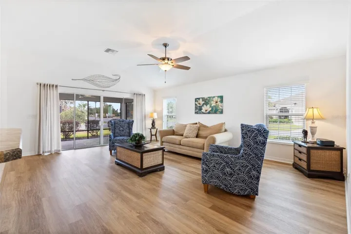 Living room with 10ft ceilings and luxury plank floor
