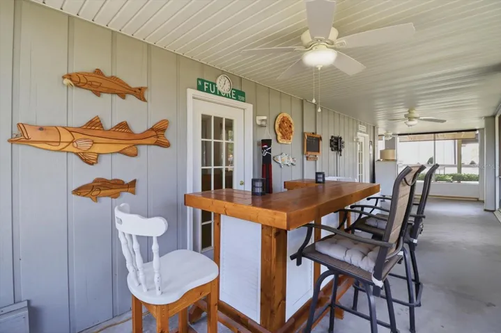 Covered, Screened Rear Porch...Outdoor Bar Conveys...Wood Fish Wall Decor Throughout DO NOT CONVEY!
