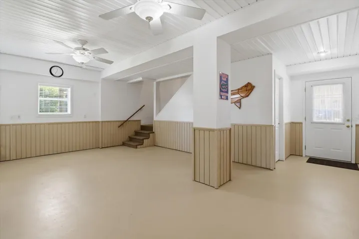 BONUS Lower Level Rec Room w/ Wainscoting, Storage Room, Door to Carport & Door to the Covered, Screened Rear Porch
