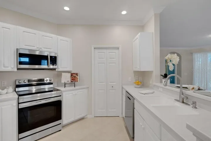 The kitchen is light and bright with a full-size walk-in pantry.