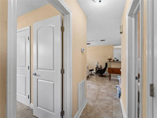 Hallway_21915CalvinLn_PortCharlotte_ArchedEntry_Daylight.jpg
