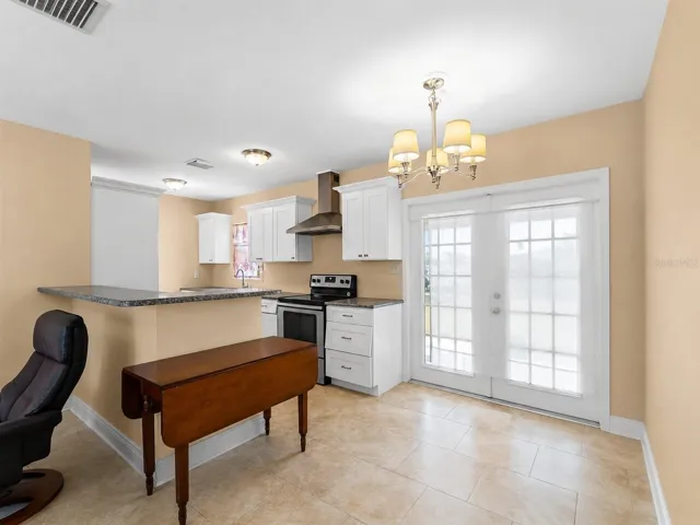 KitchenDining_21915CalvinLn_PortCharlotte_OpenConcept_SliderView.jpg
