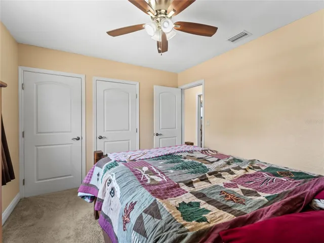 Bedroom_21915CalvinLn_PortCharlotte_NaturalLight_Corner.jpg