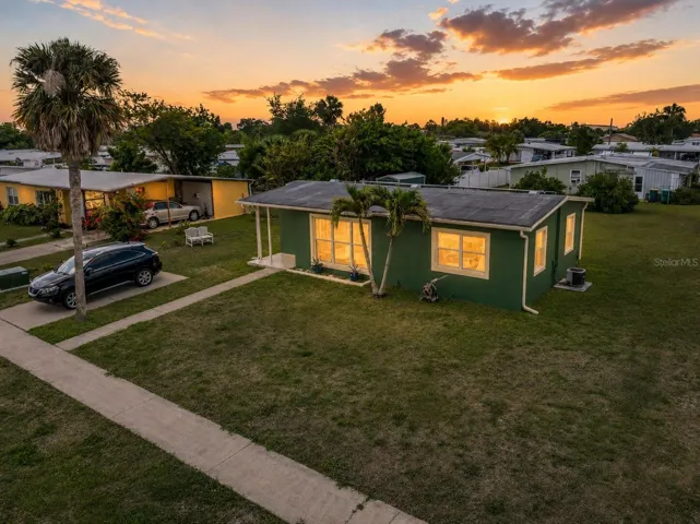 FrontExterior_21915CalvinLn_PortCharlotte_Sunset_Daylight.jpg