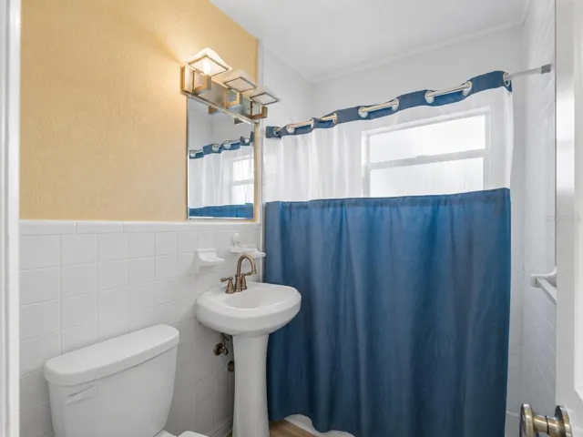 Bathroom_21915CalvinLn_PortCharlotte_CleanFinish_Daylight.jpg