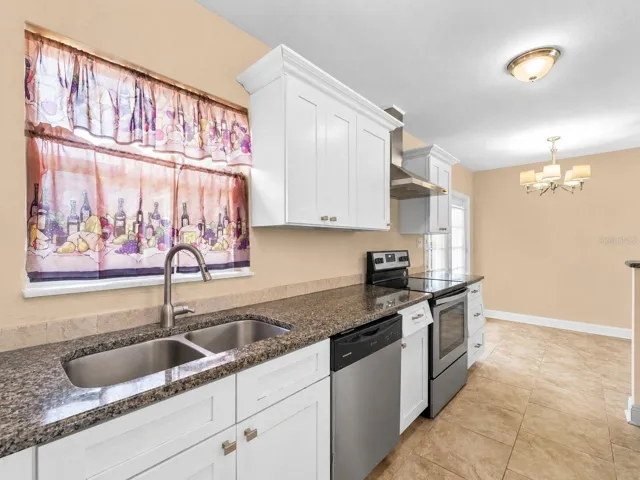 Kitchen_21915CalvinLn_PortCharlotte_StainlessAppliances_Daylight.jpg