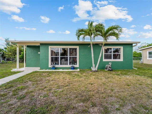 FrontExterior_21915CalvinLn_PortCharlotte_CurbAppeal_Daylight.jpg