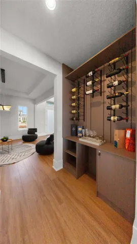 Custom wine display and entertainment bar off the foyer.