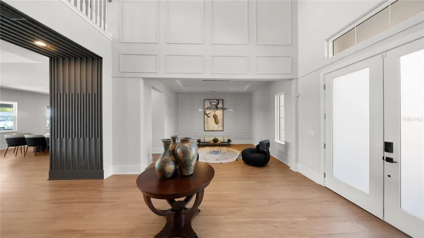 Open-concept foyer with modern architectural details and natural light.
