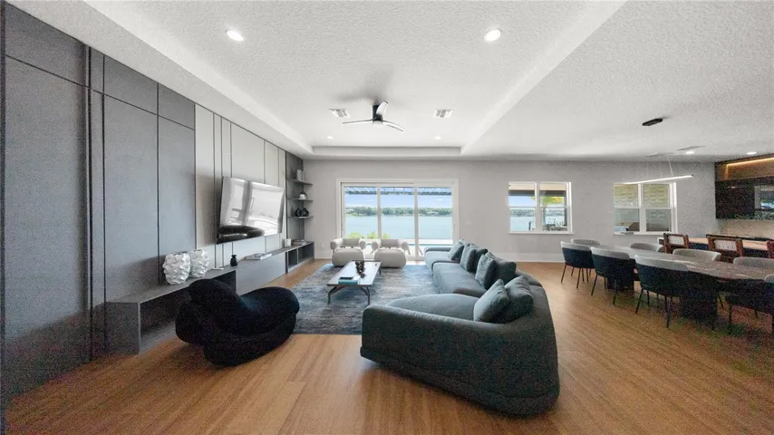 Spacious great room with floor-to-ceiling accent wall and lake views