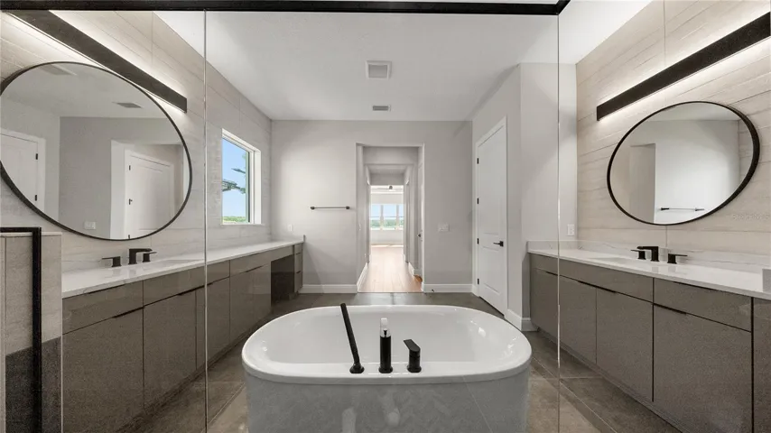 Large-format modern tile in bathrooms