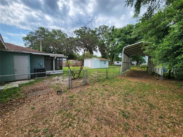 Fenced Back Yard and Covered RV Space with Electric Hook UP